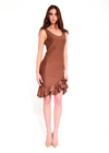 Woman wearing a brown dress with ruffled hem on a white background
