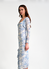 Woman wearing a floral dress on a white background