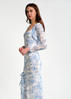 Woman wearing a floral dress on a white background